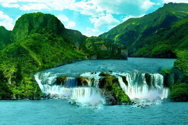 Waterfalls on the background of emerald greenery