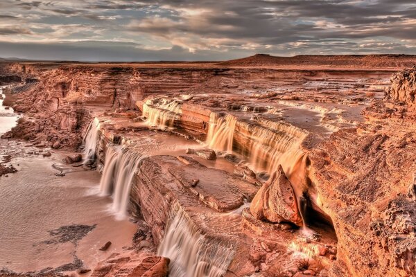 Waterfalls in the canyon, cloudy weather