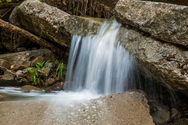 High stones and from them a waterfall