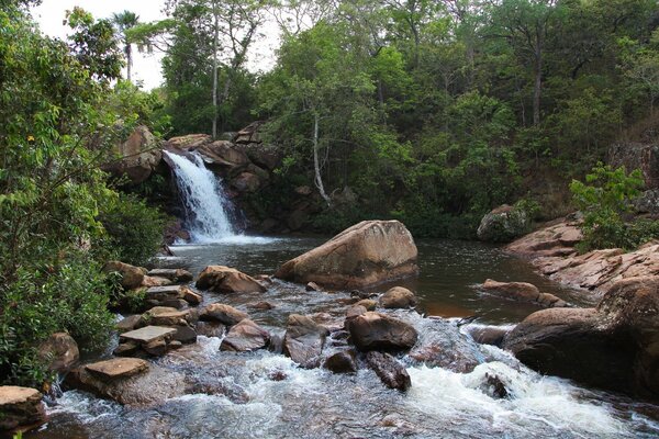 Waterfall with big brown stones