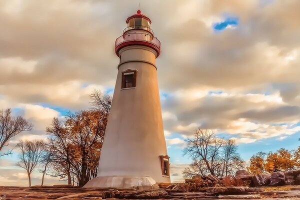 The lighthouse and the sky in the autumn landscape