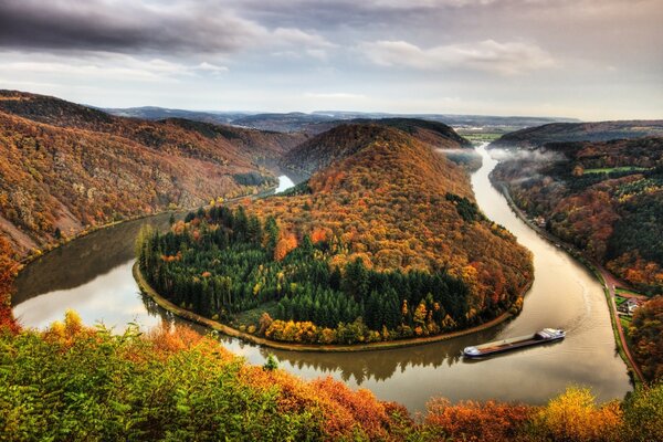 An unusual river among the autumn forest