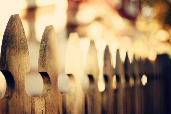 Picket fence made of wood with a pattern