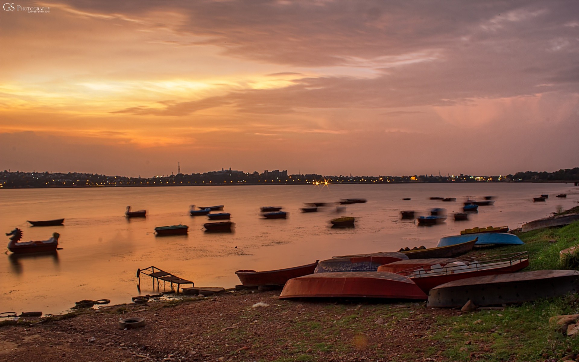 lake water sunset beach dawn sea sun travel seashore dusk boat ocean landscape sky