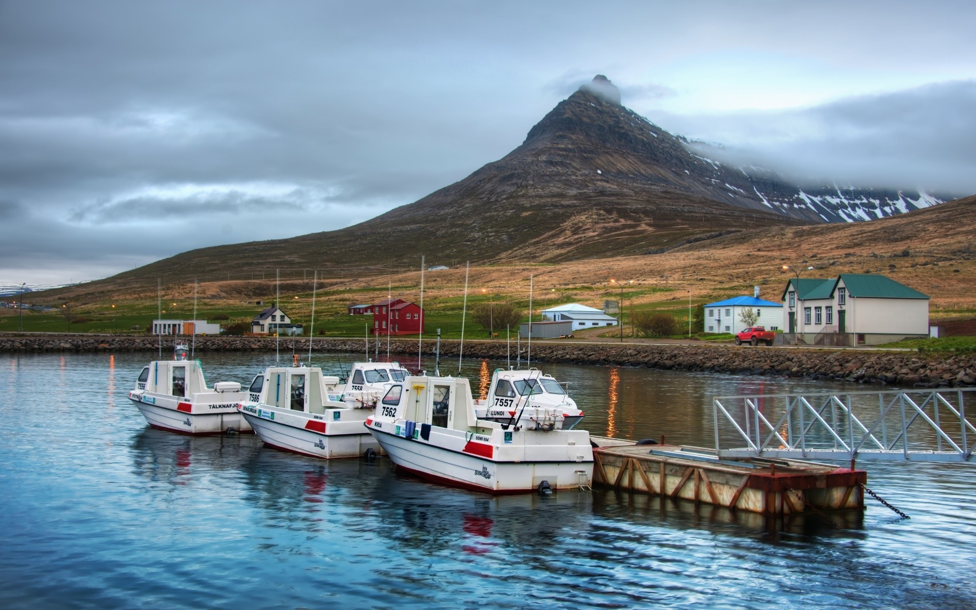 lake water travel sea seashore watercraft boat sky island harbor ocean tourism landscape outdoors transportation system mountain bay fjord