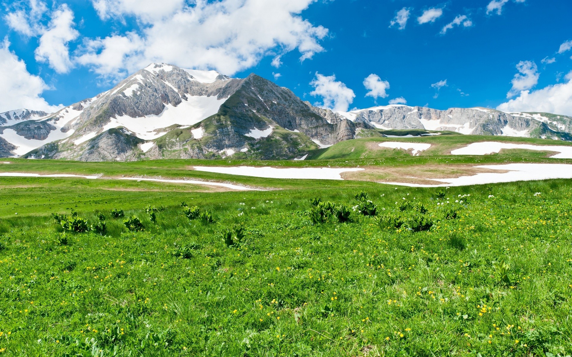 spring landscape mountain nature travel sky outdoors scenic grass summer hayfield daylight valley mountain peak hill sight cloud snow water