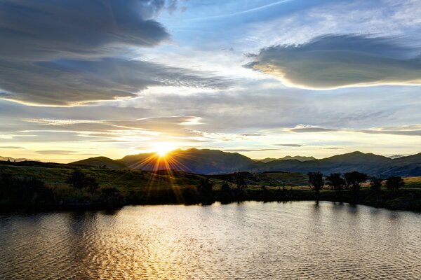 Natural landscape with sunset on the water horizon