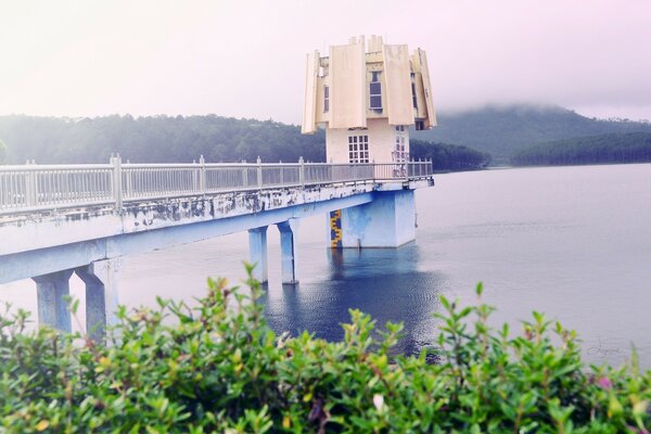 Bridge over the river with a house