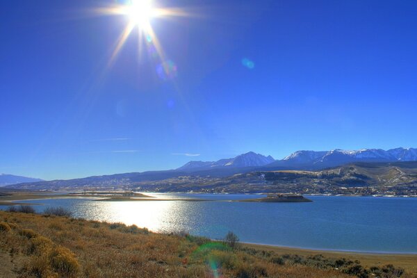 The grassy shore of a beautiful lake