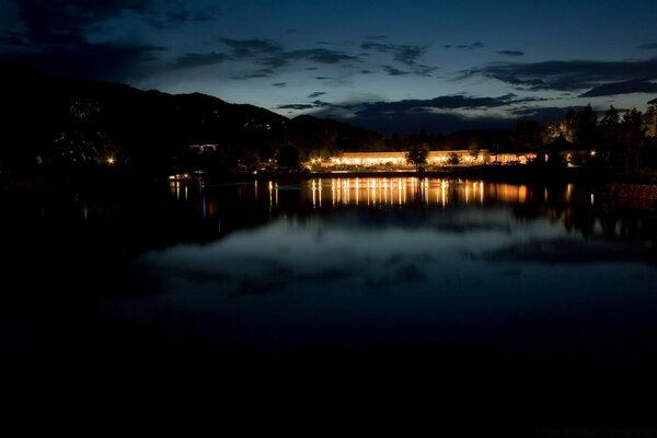 Light is reflected in dark water