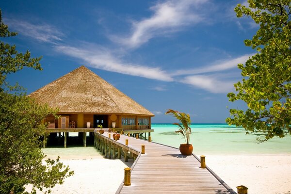 Bungalow in the middle of the ocean on a tropical island