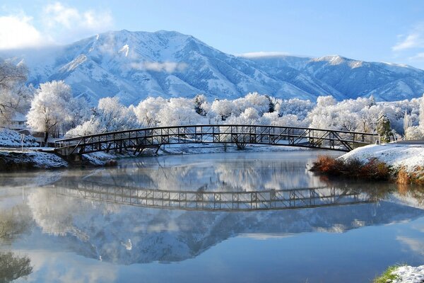 A small lake on the background of a landscape of mountains