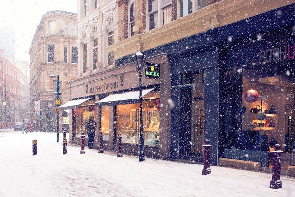 A street in the city, a light snowfall