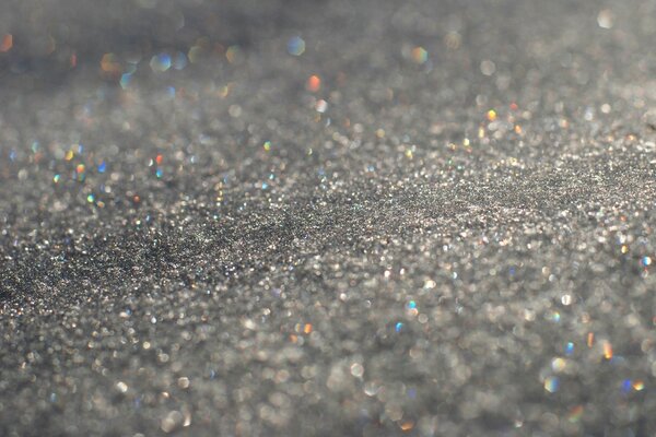 Blurred drops on gray asphalt