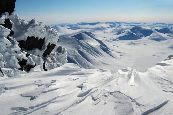 View from the top of the snow-capped mountains