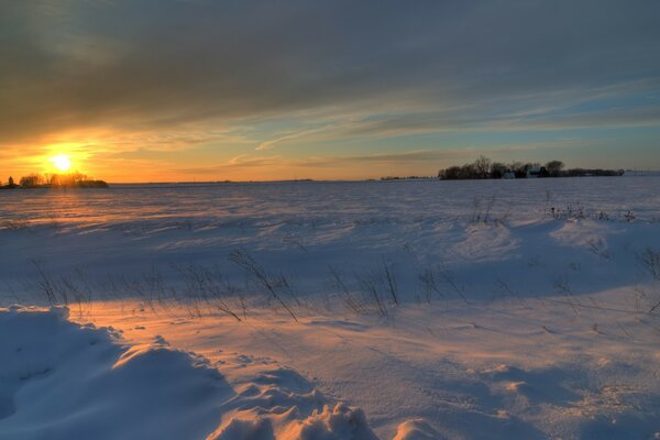 Snow-covered fields away from the city