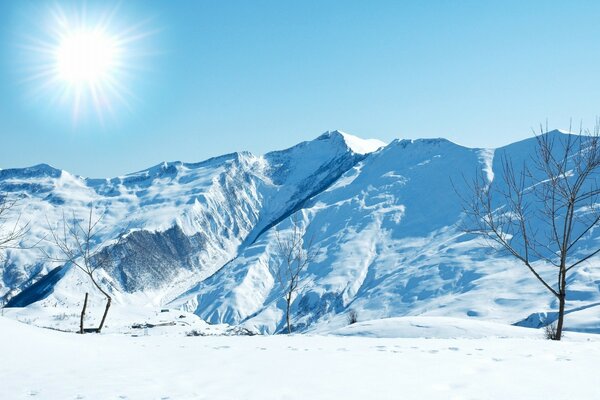 Winter landscape. Frost, mountains, bright sun