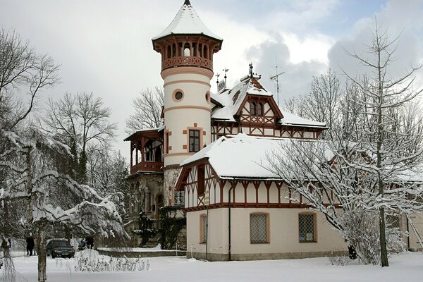 Winter manor with a tower. Landscape