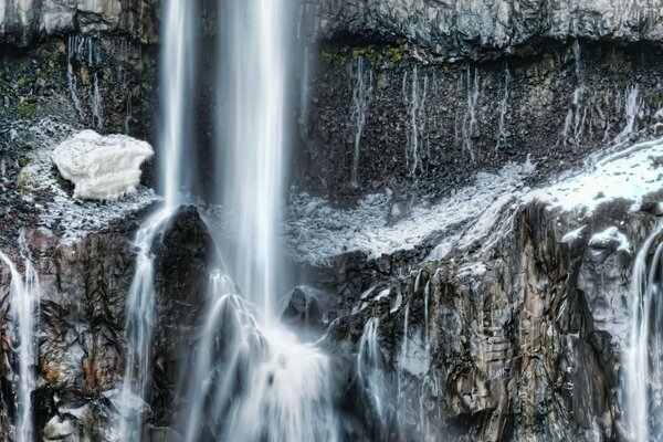 Waterfall in the cold rocky mountains