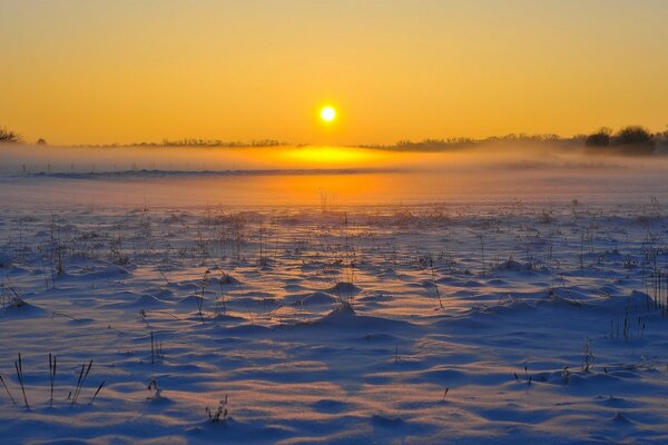 Reflection of a frosty sunset in the snow