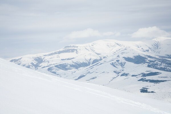 Cold border of snowy mountains