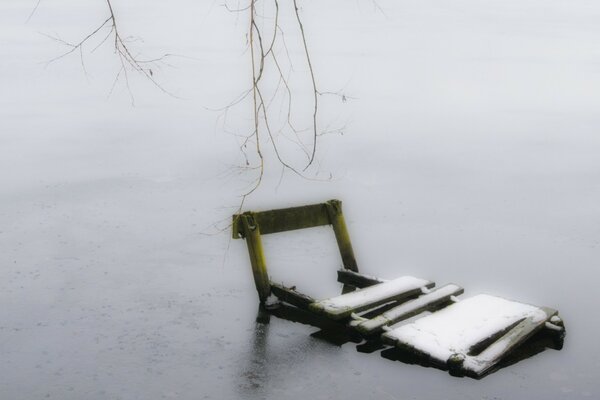 Frozen raft in the ice on the river