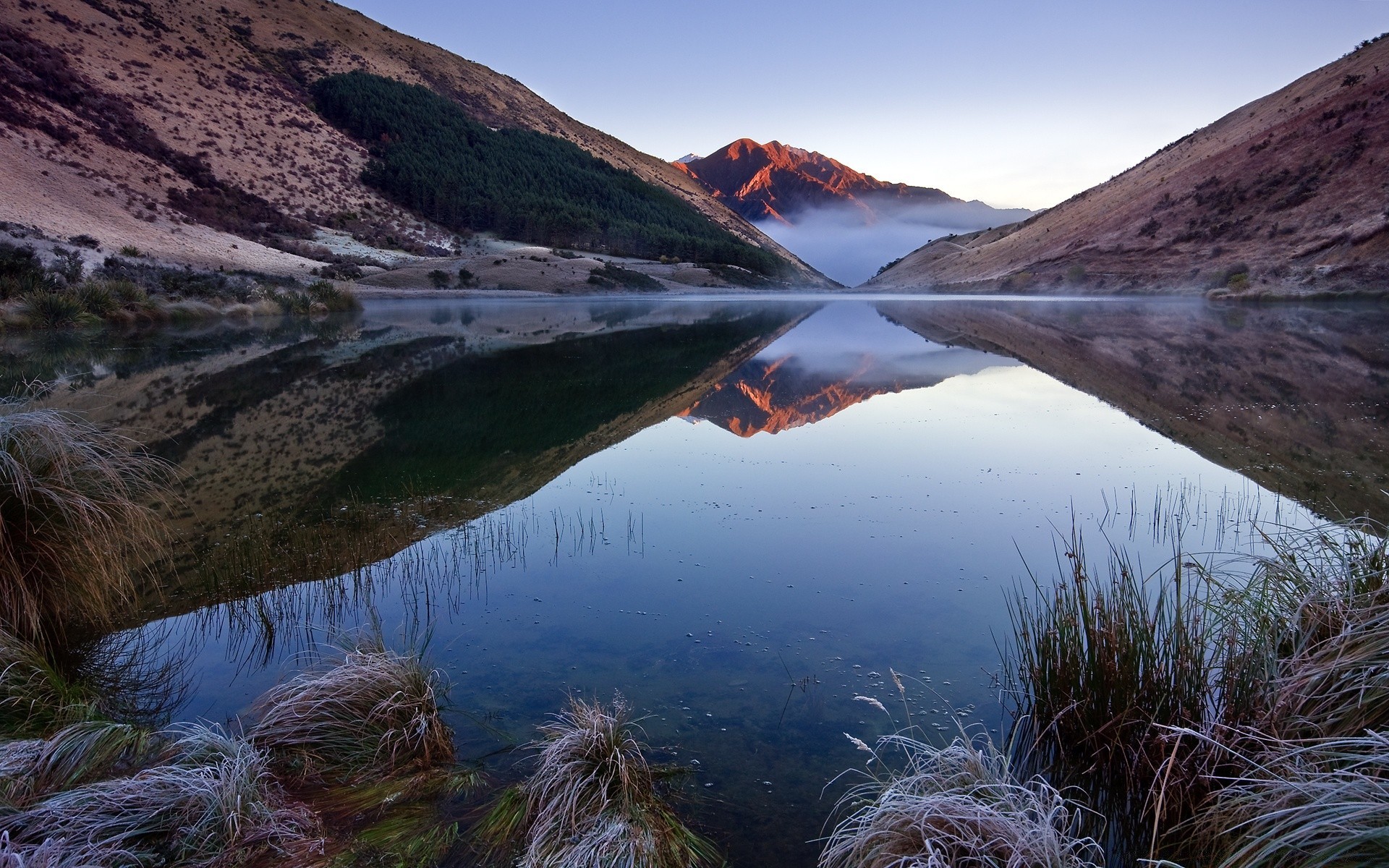 lake landscape water mountain travel scenic nature outdoors sky river reflection rock hill seashore