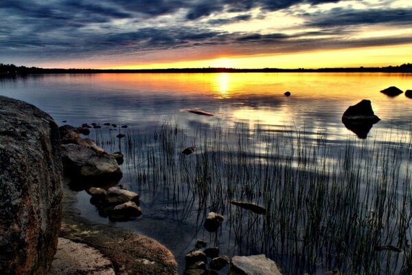 Beautiful sunset and reflection of the sun on the lake