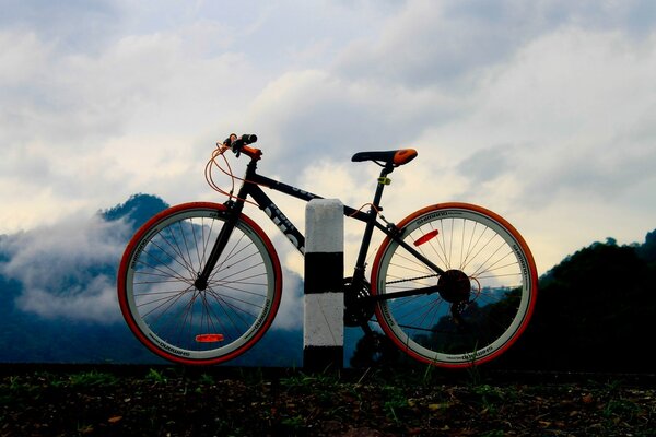 Red bike on the background of mountains