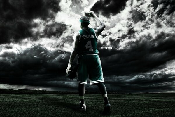 Basketball player on the background of a thunderstorm