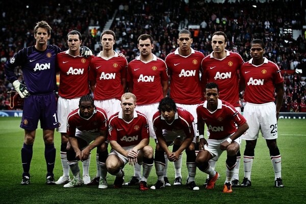 A team of football players lined up for a shared photo