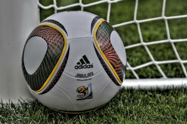 A soccer ball near the goal net