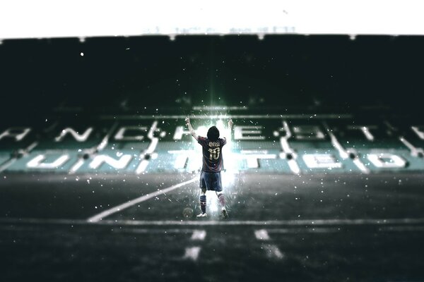 Football player at the night stadium during the rain