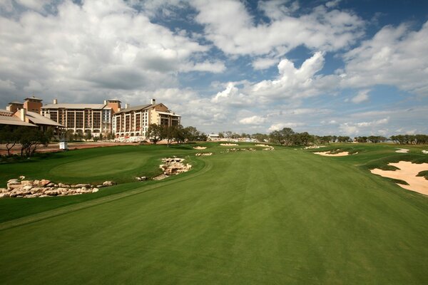 Perfect lawn on the background of a mansion