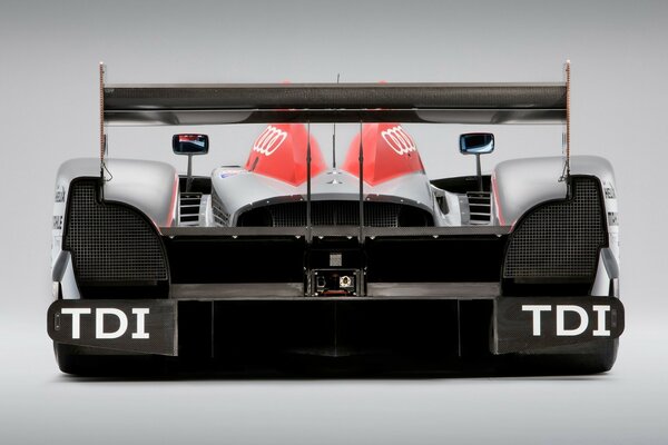 Photo of a racing car from behind