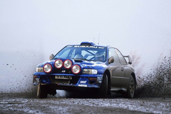 Sports car on a U-turn in the mud