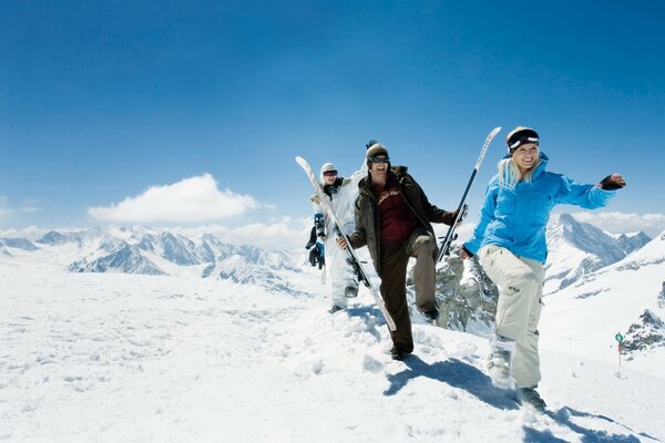 Funny skiers climb the mountain