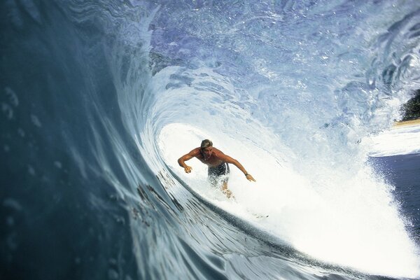 Surfer catches a big wave