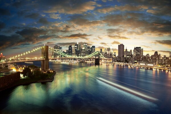 Metrópole à noite. Ponte sobre o rio