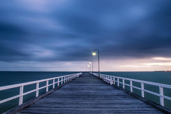 Landscape with a bridge. Clear sky. The Blue Sea