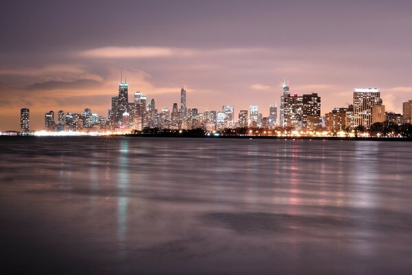 A big city near the ocean in lights