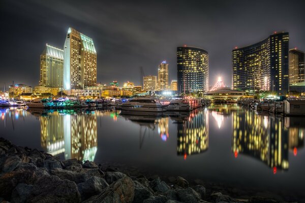 Night city in the reflection of water