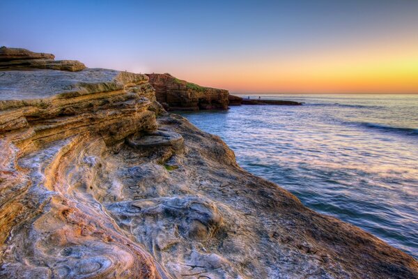 América. Oceano. Pôr do sol e reflexão