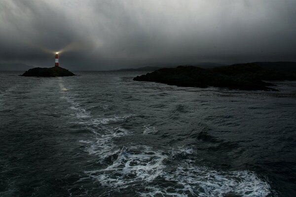 The ocean at sunset. Light from the lighthouse