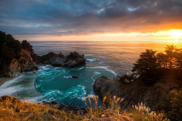 Beautiful sunset on the rocky seashore