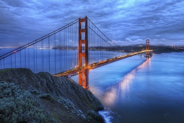 Bridge over the water. Evening and clouds