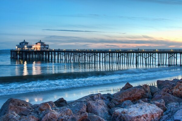 Lighthouse on the pier near the sea