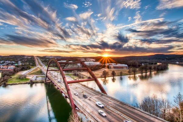 Sunrise over the bridge over the river