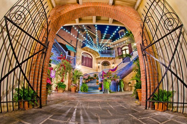 A cozy bright courtyard behind an open gate