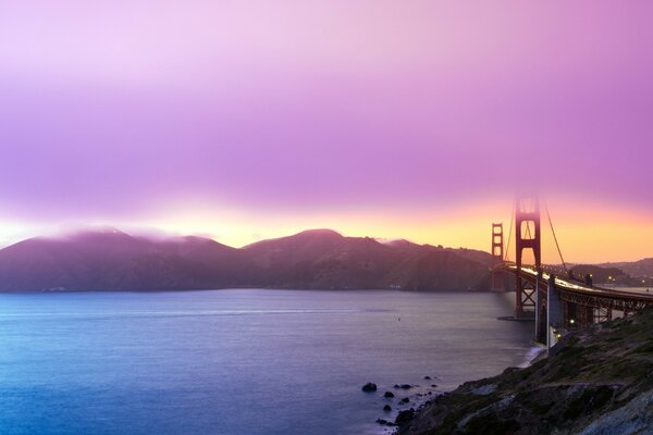 Beautiful sunset with a view of the water and the bridge